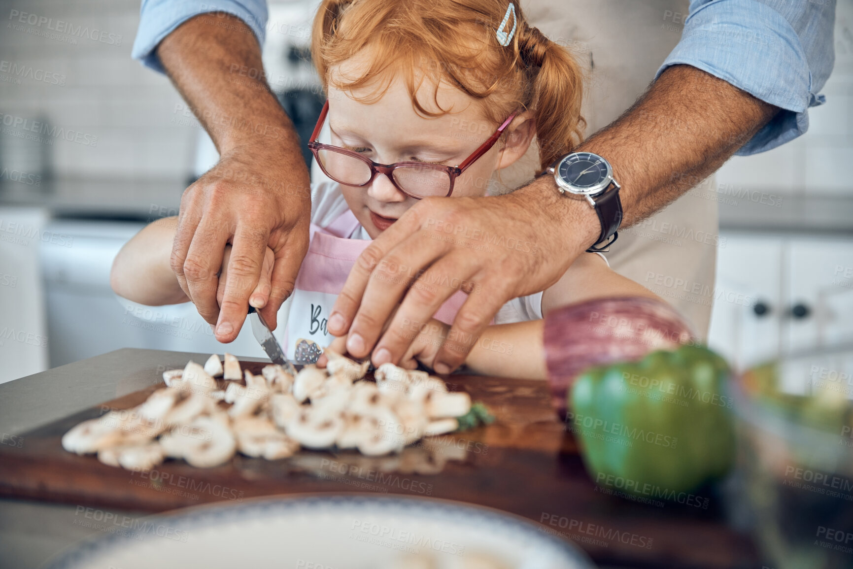 Buy stock photo Kid, dad and cooking, cutting board and food in kitchen, family home or house for childhood fun, learning and development. Parent helping little girl chop mushroom vegetables for lunch or dinner meal