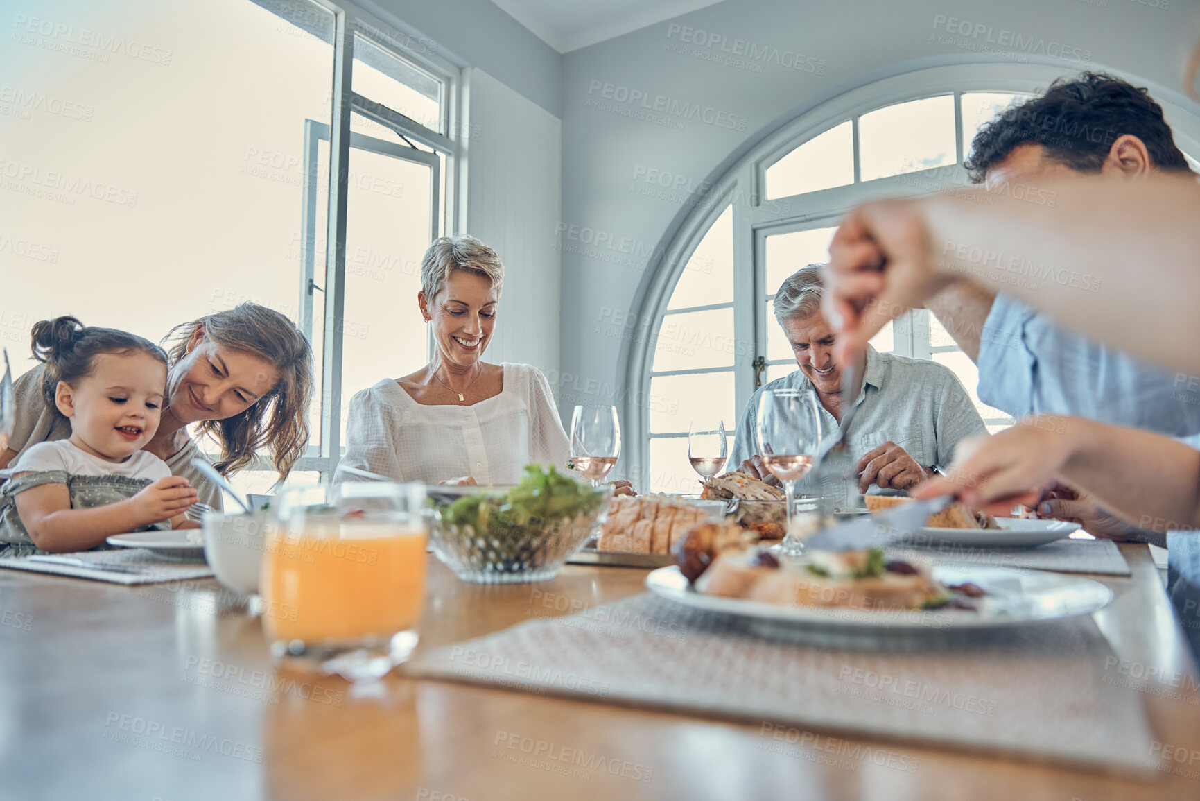 Buy stock photo Eating food together, lunch and happy family bonding, having fun and enjoy quality time in home dining room. Love, happiness and big family of hungry grandparents, parents and child eat brunch buffet
