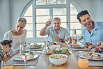 Big family, lunch and happy celebration toast with grandparents, parents and kid together in home. Food, communication and cheers of grandfather at dining table with young and senior people.
