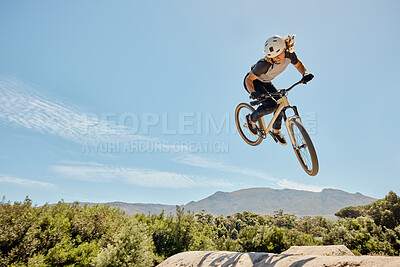 Buy stock photo Mountain bike, high jump and athlete doing a trick in nature for a competition or training. Bicycle, fitness and cyclist doing a crazy stunt in the air with adrenaline for a fun sports championship.