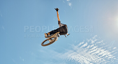 Buy stock photo Bicycle stunt, man cycling in air jump on blue sky mock up for sports action performance, fitness training or outdoor bike performance. Professional sports person with bmx bicycle adventure mockup