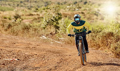 Buy stock photo Mountain bike, sports and man cycling in nature on an outdoor dirt road training for competition. Bicycle, action and athlete riding to practice for a race on a hill in sportswear on adventure trail.