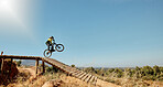 Sports, mountain bike and ramp jump in nature, cycling 
and outdoors stunt performance. Fitness, workout and exercise of bmx athlete and racer on bicycle training for competition, race or contest.


