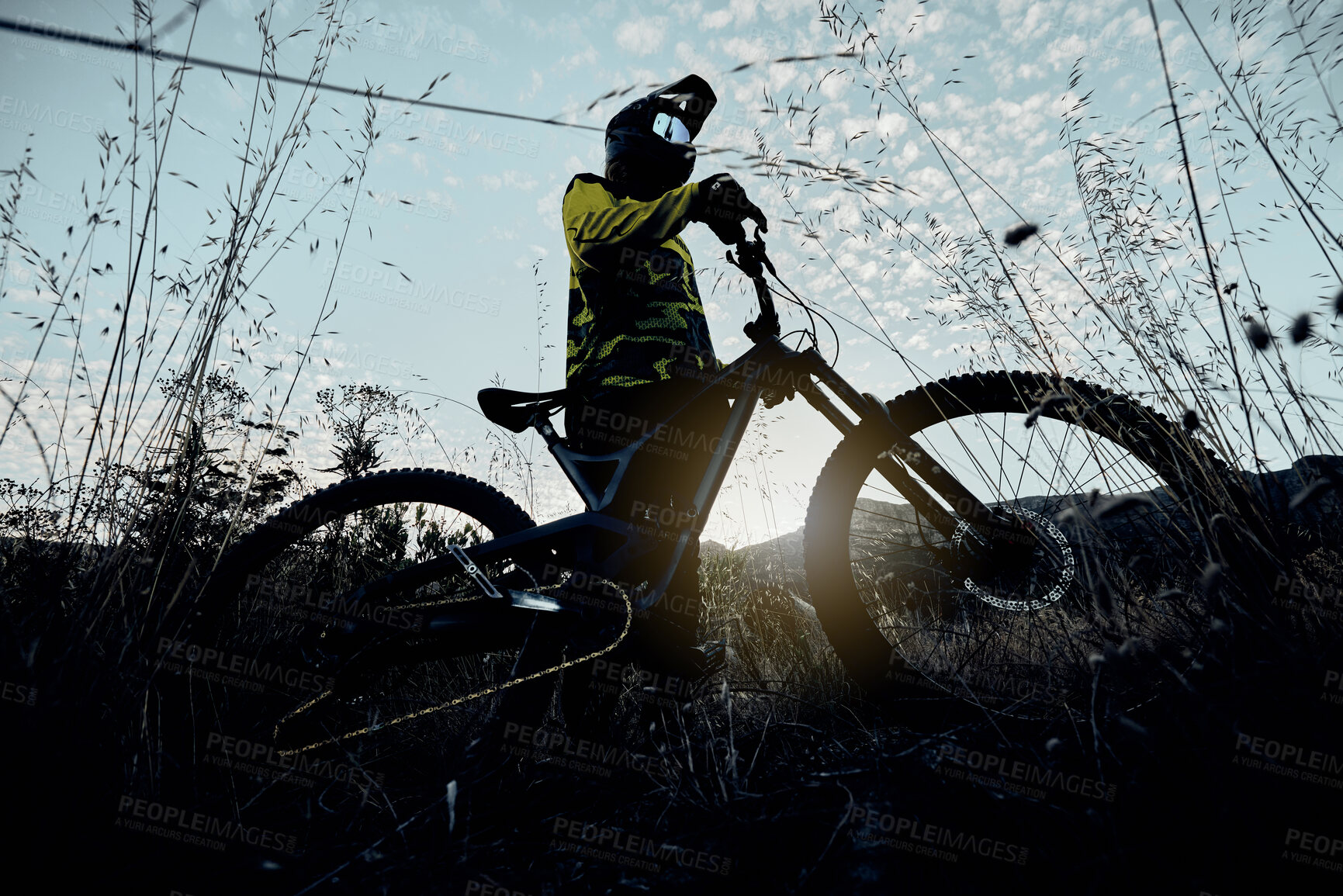 Buy stock photo Nature cycling, blue sky and man with mountain bike for  cardio workout, fitness journey or travel in countryside below view. Dark shadow flare, exercise and athlete rider training for triathlon race