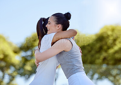 Buy stock photo Women, friends and success hug at park outdoors for congratulations or celebration of winning, goals or targets. Hugging, sports fitness or thank you of female training with tennis personal trainer

