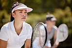 Tennis, double games and focus women ready to start professional competition match in Melbourne, Australia. Tennis court player, athlete and teamwork with tennis racket, bat and sports training goals