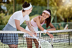 Woman, tennis and friends with smile in sports, conversation or discussion on the court outdoors. Female in sport fitness relaxing together talking after match, game or workout on the tennis court