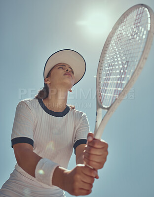 Buy stock photo Professional tennis player, fitness and woman athlete playing sports, match and games with tennis racket on blue sky lens flare. Below of tennis girl with focus mindset in training to win competition