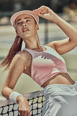 Buy stock photo Tennis, sports and fashion with a woman athlete posing on a court after a match for fitness or style. Training, exercise and health with a fashionable young female tennis player after a sport match