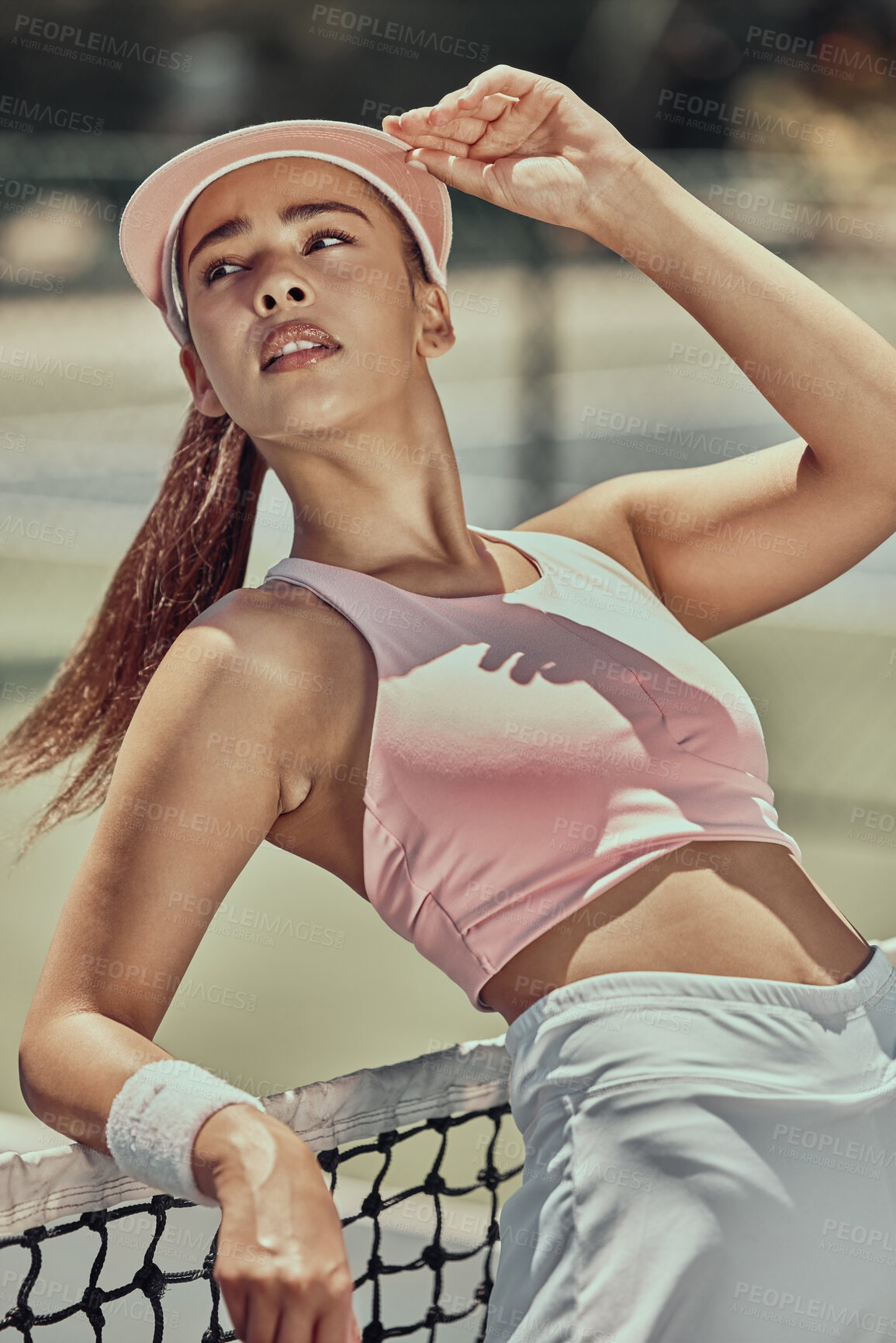 Buy stock photo Tennis, sports and fashion with a woman athlete posing on a court after a match for fitness or style. Training, exercise and health with a fashionable young female tennis player after a sport match