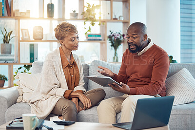 Buy stock photo Finance, mortgage and black couple in debt planning a budget, savings or insurance payments at home. Mature, inflation and married black woman talking to an African angry partner about money problems