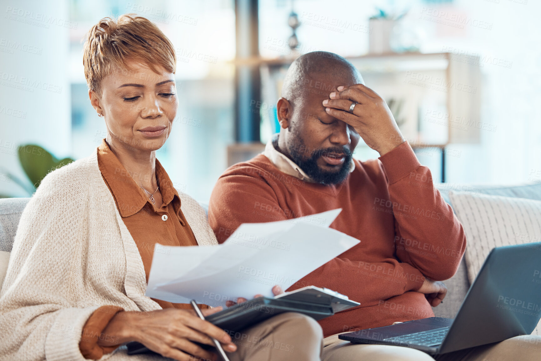 Buy stock photo Black couple, stress and laptop in finance debt, expenses or mortgage bills together on the living room sofa at home. Man and woman suffering in financial pressure, payments or issues on computer