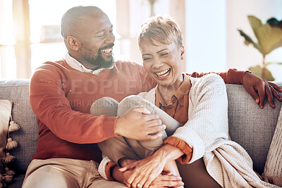 Buy stock photo Funny mature couple laughing on living room sofa, couch and apartment for love, care or easy lifestyle together. Smile, joke and relax black couple in lounge, happy marriage and romantic relationship