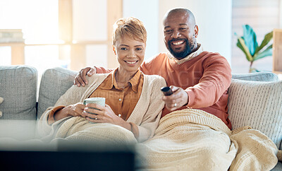 Buy stock photo Mature couple watching tv, news and movie, cable show and media broadcast, living room sofa and easy lifestyle. Happy, smile and black people change remote, television subscription and home streaming
