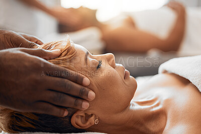 Buy stock photo Spa, relax and head massage with old woman for wellness, luxury and skincare. Peace, health and facial with lady on bed of resort salon for treatment, beauty and care in her retirement lifestyle