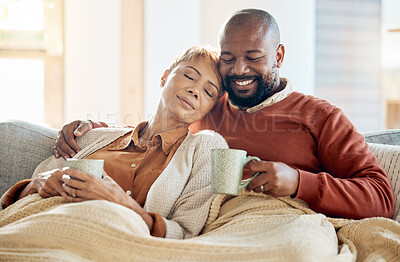 Buy stock photo Black couple relax on sofa with coffee, blanket and smile on winter weekend morning in home. Peace, comfort and love, happy man and tired woman, cozy time on couch with drink in living room together.