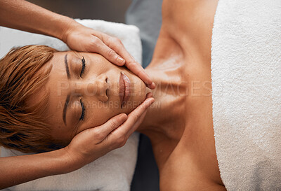 Buy stock photo Top view, hands and facial massage at spa for beauty, treatment or relax. Face, skincare and wellness of black woman at peace relaxing, release stress or tension with eyes closed at luxury resort.


