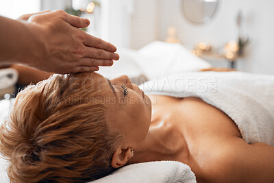Buy stock photo Spa, black woman and head massage to relax, peaceful and calm for clear mind, wellness and stress relief on table. Senior female, physical therapy and luxury vacation for health, body care and fresh.