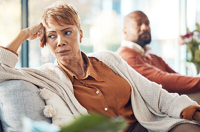 Buy stock photo Mature couple, divorce and fighting on sofa in house, home living room or marriage counseling therapy. Stress, frustrated or depression for black woman and man in psychology counselling for cheating