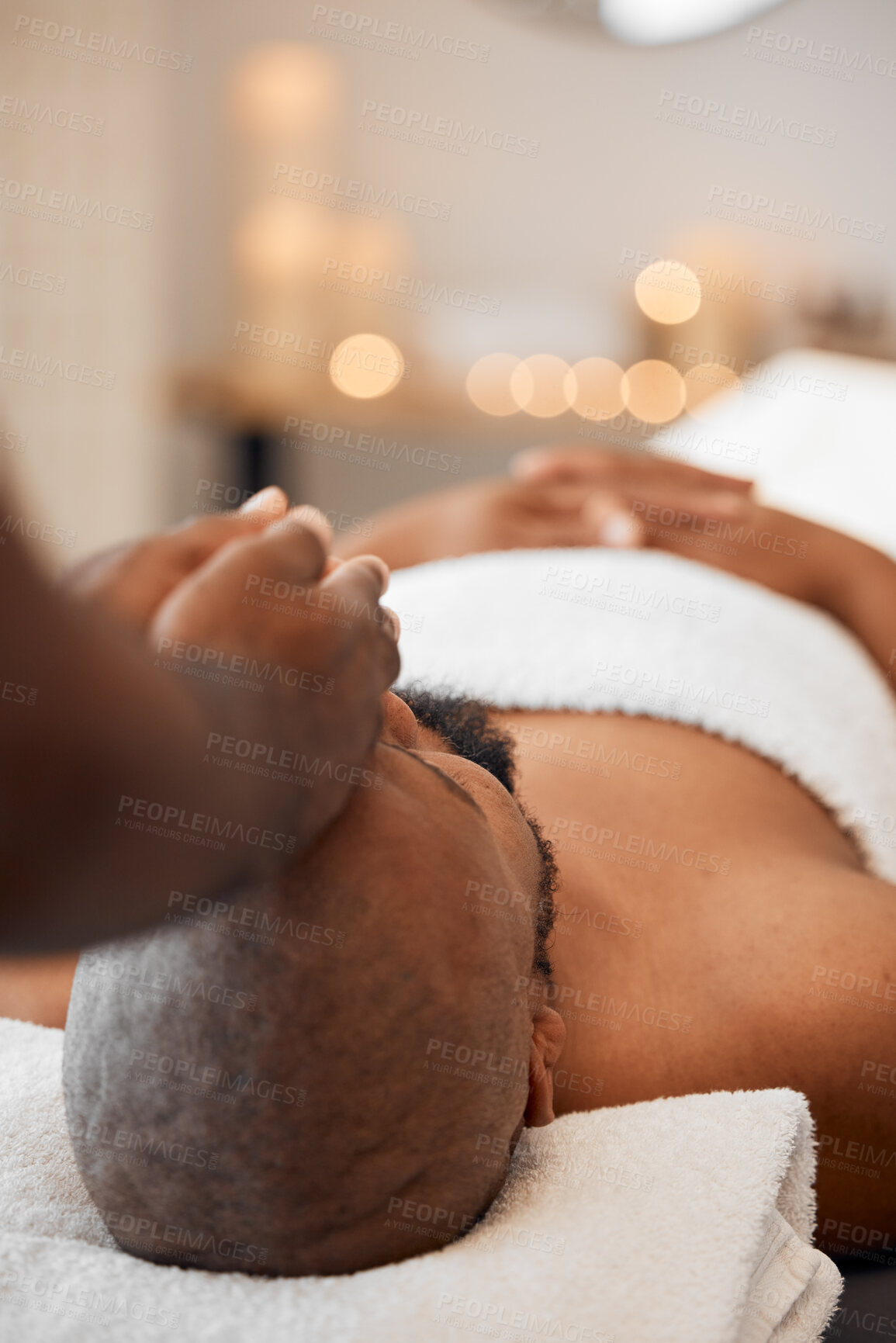 Buy stock photo Black man, head massage or relax spa in relax hotel, wellness salon or luxury resort for self care, mental health or peace. Massage therapist, hands and zen aromatherapy for healthy stress management