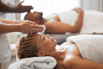Buy stock photo Woman, head and spa massage of couple at beauty salon, holiday resort and wellness vacation, face cosmetics and peace in Bali. Black woman, luxury facial and relax treatment from skincare therapist 