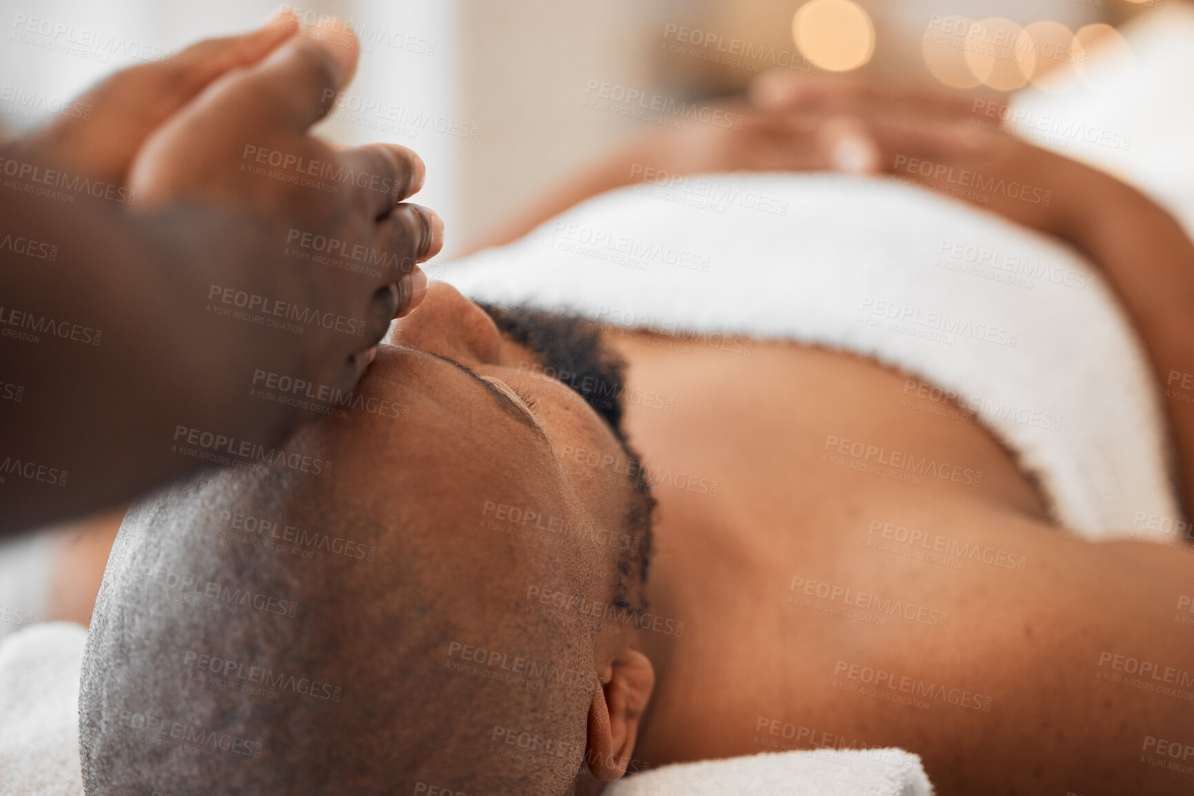 Buy stock photo Spa, African man and masseuse hands for head massage, mental health and body wellbeing. Calm, relax and luxury beauty skincare wellness, physical therapy treatment or peaceful facial skin detox