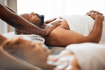 Buy stock photo Black man, spa and couple massage for relax, skincare and wellness at resort on anniversary weekend. Reflexology therapist touch body muscle of sleeping guy on salon bed, stress relief and zen detox 