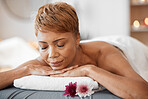 Peace, wellness and black woman at spa sleeping on cosmetology salon bed for relaxing back treatment. Relax, calm and peaceful client ready for professional and luxury body care service.