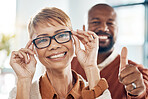 Optometry, thumbs up and black woman with glasses for vision in a retail optical or eyewear shop. Happy, smile and African lady with new spectacles standing with her husband at optics clinic or store