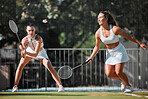 Fitness, team and women with tennis on tennis court, athlete playing game with focus and sport workout outdoor. Sports match, young and cardio while training and exercise together with teamwork.