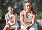 Badminton practice, double games and training women ready to start professional competition match in Melbourne, Australia. Tennis court player, athlete and teamwork with sports racket, bat and focus