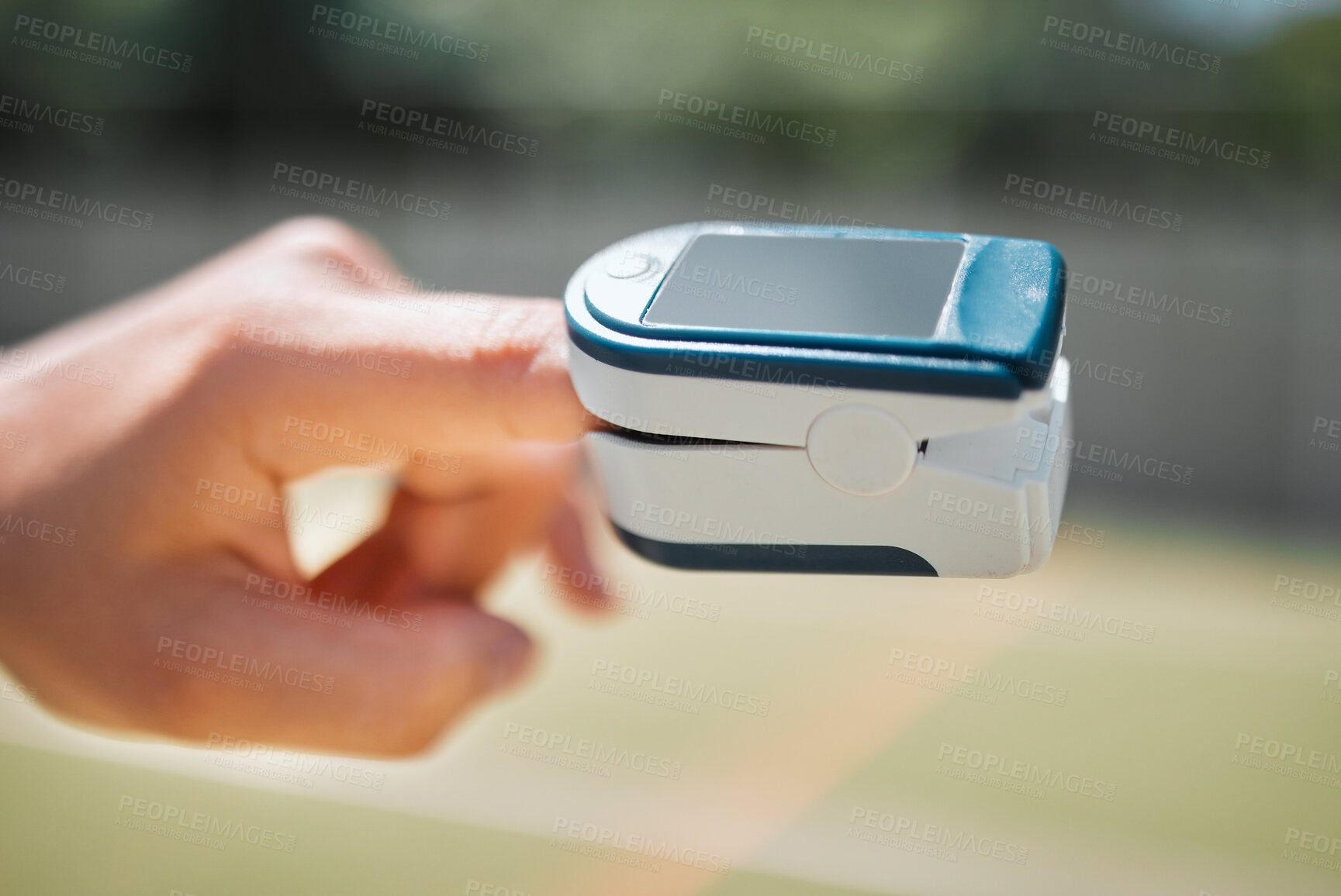 Buy stock photo Hand, health and pulse oximeter in nature for oxygen measurement. Healthcare, wellness or SPO2 meter on finger of person to check, monitor or test blood levels or heart rate outdoors at park outside
