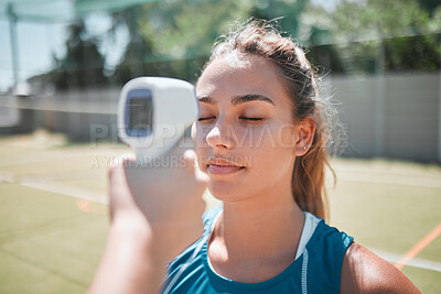 Buy stock photo Ftiness, sports and thermometer of a woman athlete before a match or game on the court. Temperature, safety health and wellness of a strong and active woman before exercising in sport training.