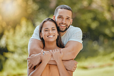 Buy stock photo Couple, park hug and smile in nature feeling love, commitment and people together outdoor. Portrait of a happy girlfriend and boyfriend hugging with care for anniversary or engagement