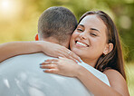 Face, portrait and love with a couple hugging outdoor in nature or garden together in sunny summer. Park, smile and romance with a man and woman bonding or embracing with affection during the day