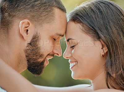 Buy stock photo Couple, forehead and hug with smile for love, romance or embracing relationship together in the outdoors. Happy man and woman touching foreheads and hugging in happiness for loving affection outside