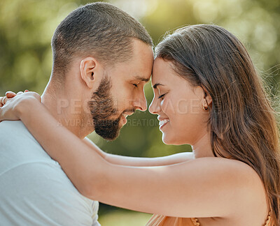 Buy stock photo Couple, love and forehead touch in garden, summer park or outdoor backyard in Spain for care, happiness and easy lifestyle together. Smile, romance and date of man, woman and people in happy marriage