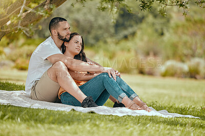 Buy stock photo Relax, love and couple by tree in park for peace, summer and wellness date together. Happy, hug and health with man and woman lying on grass with blanket for spring, nature and support lifestyle