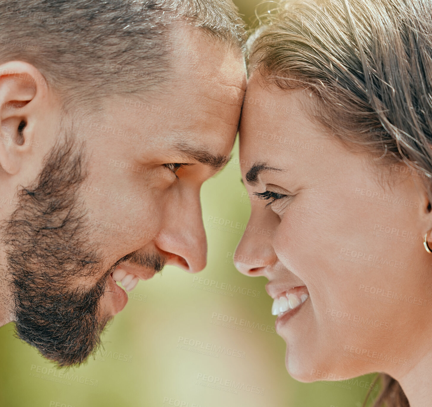 Buy stock photo Happy, couple and smile with forehead for love, romantic or relationship happiness together in the outdoors. Closeup of man and woman face smiling touching foreheads in romance, embracing or care