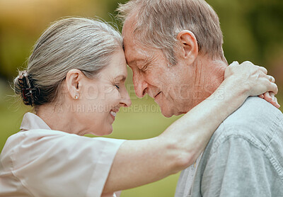 Buy stock photo Elderly, couple and forehead touch with love, care and bonding in retirement, outdoor and nature. Senior man, woman and retired romance in park, garden or backyard for hug, happy or face together