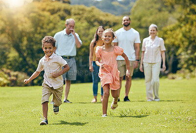 Buy stock photo Running, happy and summer with big family in park for happy, freedom and health. Nature, spring and environment with kids playing and on grass field with parents and grandparents for youth lifestyle