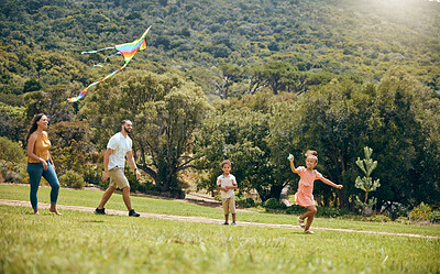 Buy stock photo Kite, parents and children being happy in nature and playful in quality time together, on weekend and on vacation. Family, mother and father with kids, happiness or fun with flying toy, joy or summer