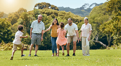 Buy stock photo Big family, nature park and happy to play with children running on grass with senior grandparents, mom and dad smile in summer sunshine. Fun mother, father and open arms to hug kids outdoors together