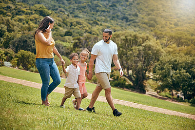 Buy stock photo Park, family and nature walking of a mother, dad and kids outdoor in the sun on a hike. Happy mom, father and kids walk on a field with parents spending quality time together with a smile on grass