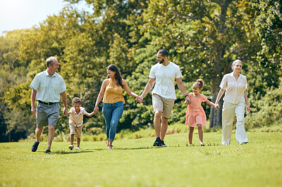 Buy stock photo Happy family, hand holding and nature park walk with mom, dad and children with grandparents. Walking mother, kids and senior people together with love, summer fun and care spending quality time