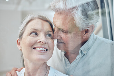 Buy stock photo Love, senior couple and hug in home, happy and bonding with smile together, for marriage and relationship being loving. Romance, man and woman being cheerful, intimate or spend quality time at window