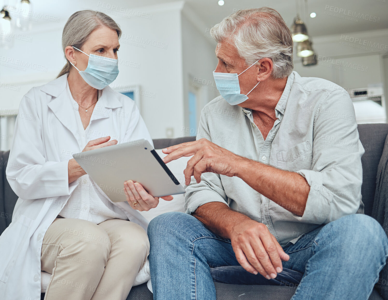 Buy stock photo Senior doctor, covid mask and digital tablet patient results in a hospital or wellness clinic. Healthcare consulting, insurance talk or health nurse consultation of elderly people speaking together