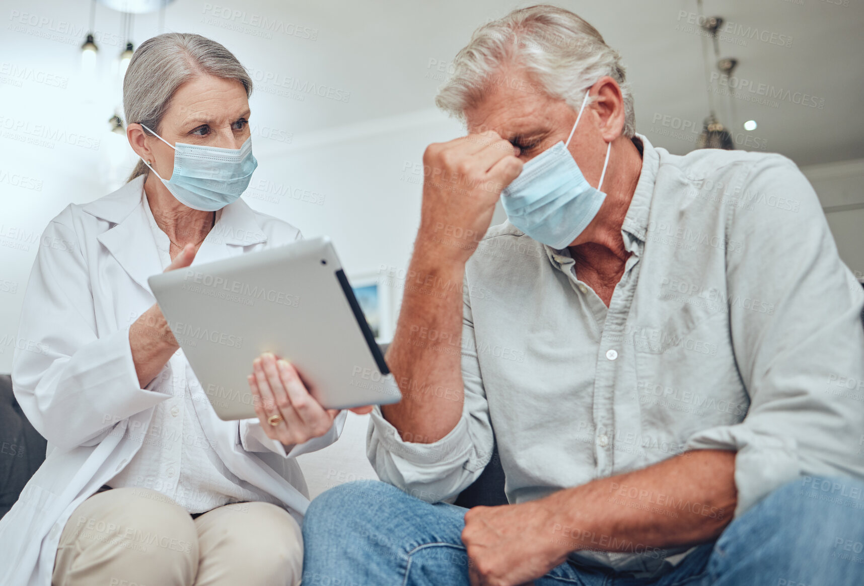 Buy stock photo Tablet, doctor and patient with mask, stress and diagnosis results for illness. Telehealth, sad male and medical professional with digital device, corona and depressed for sickness in hospital upset.