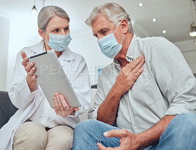 Buy stock photo Covid, tablet and healthcare with a senior man patient and doctor during a home visit for a checkup appointment. Medical, consulting and mask with a woman health professional talking to a mature male