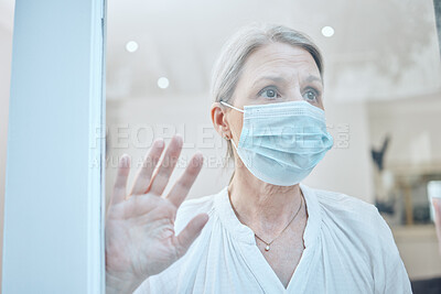 Buy stock photo Senior woman, covid and face mask with hand on window for anxiety, mental health and safety in house during retirement. Lonely female at, home during covid 19 lockdown for government compliance